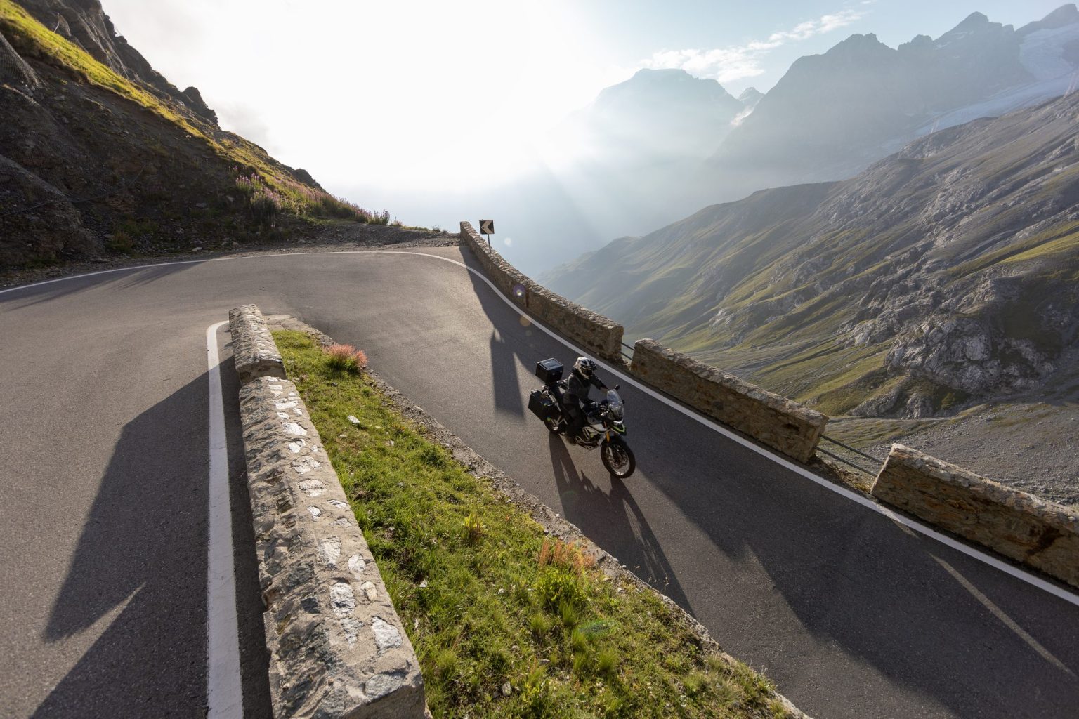 Motorcycle on a Stelvio Pass hairpin, Italian Alps
