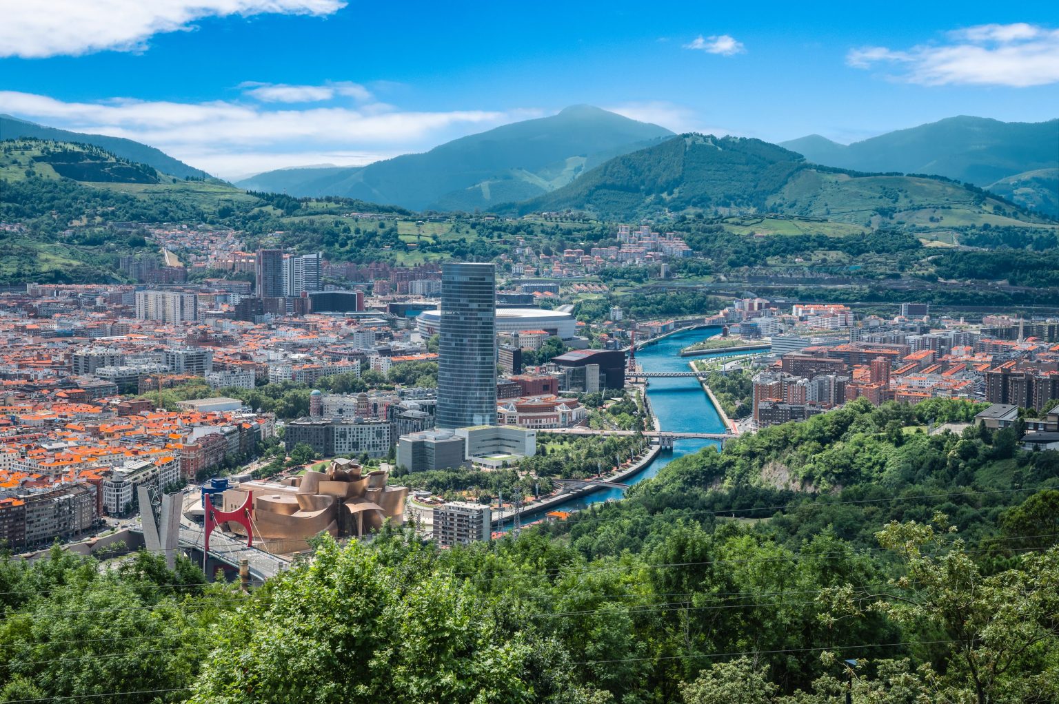 Bilbao and the Nervion river surrounded by green hills