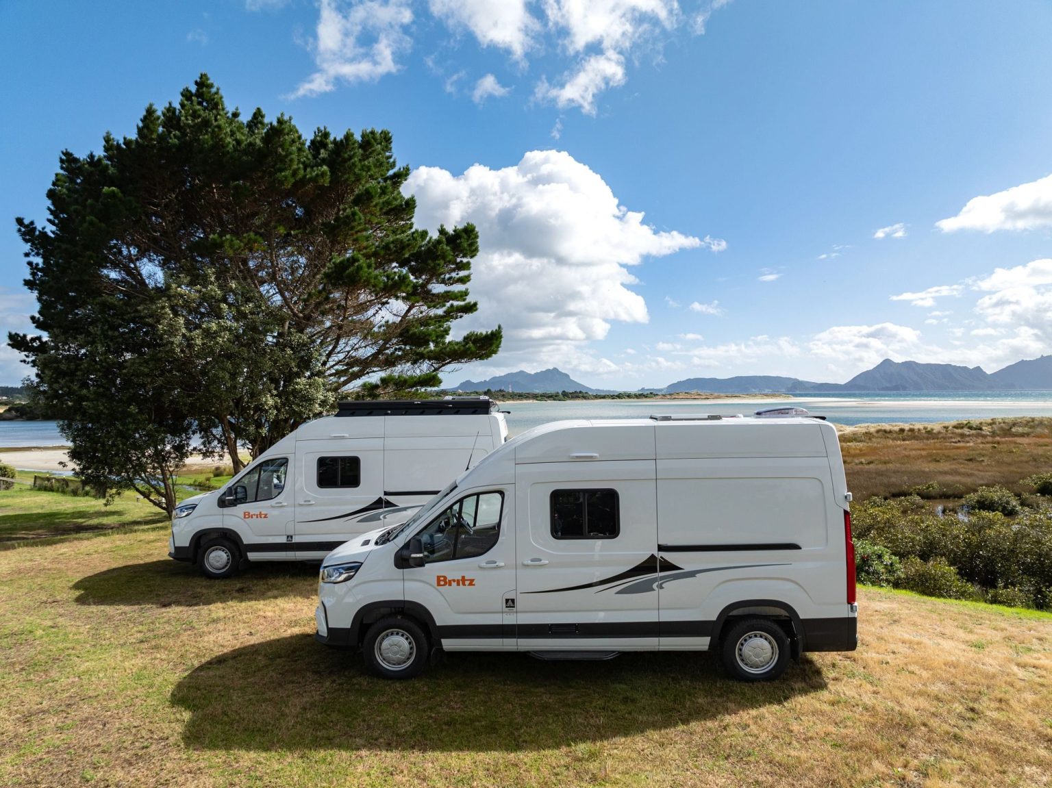 A Britz HiTop campervan at Waipu Cove, North Island, New Zealand