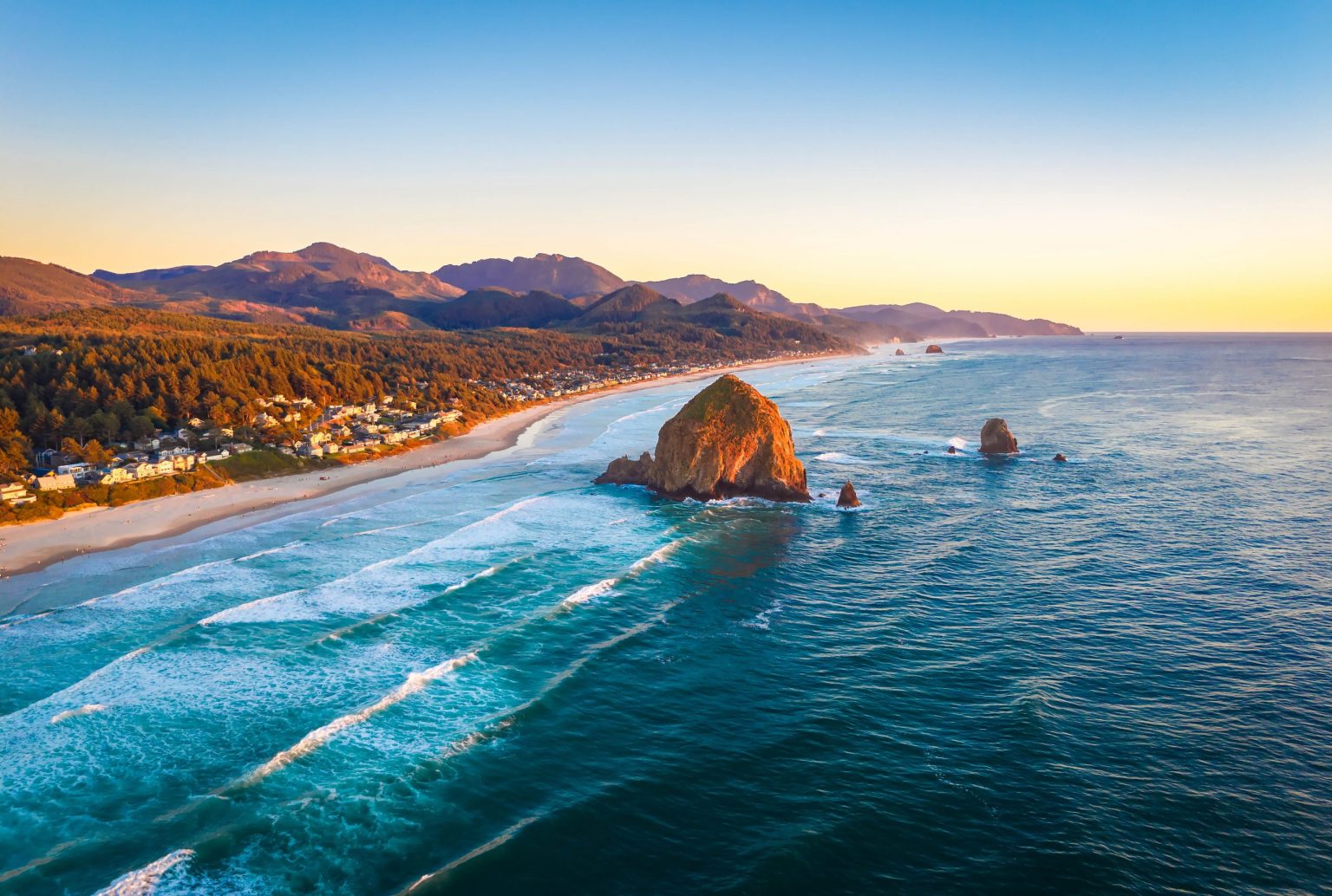 Aerial view of Haystack Rock and Cannon Beach at sunset, Oregon