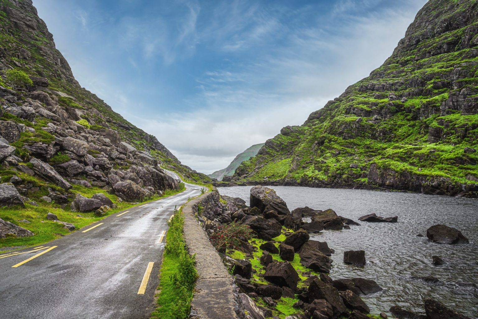Road beside a lough in the Gap of Dunloe, County Kerry