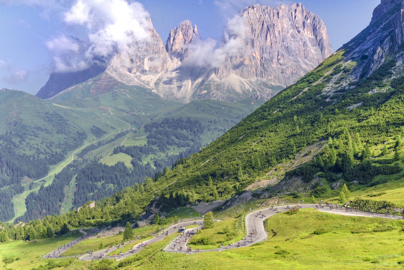 Hairpin road climbing beneath the Sassolungo in the Dolomites