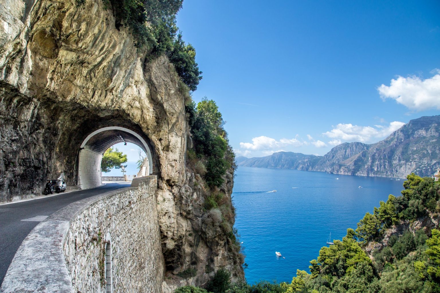 The SS163 coast road and tunnel on the cliffs near Positano, Amalfi Coast