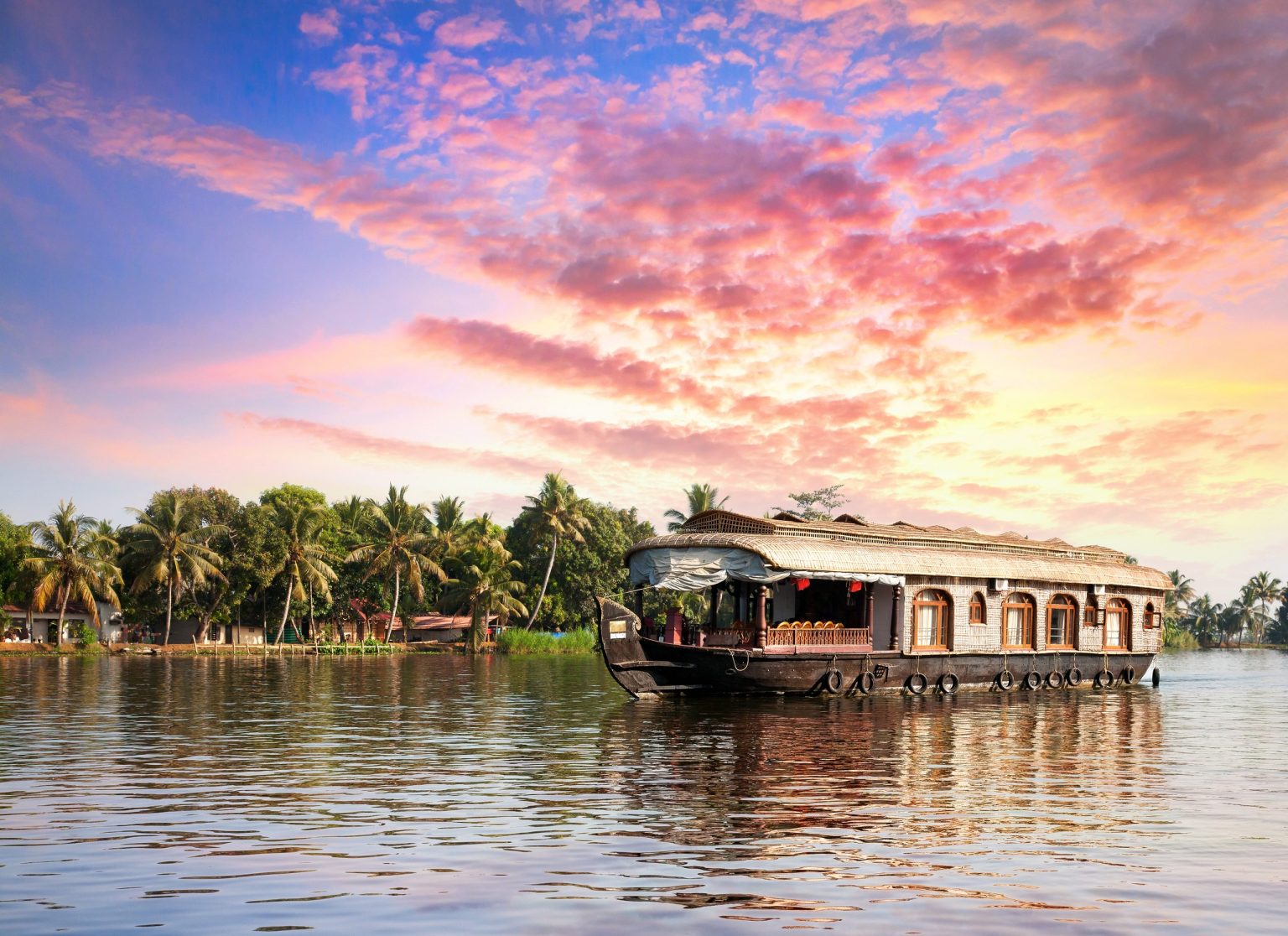 Houseboat on the Alleppey backwaters at sunset