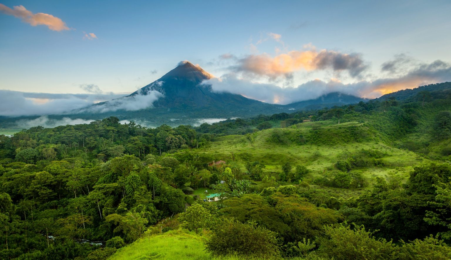 Arenal volcano rising above rainforest, Costa Rica