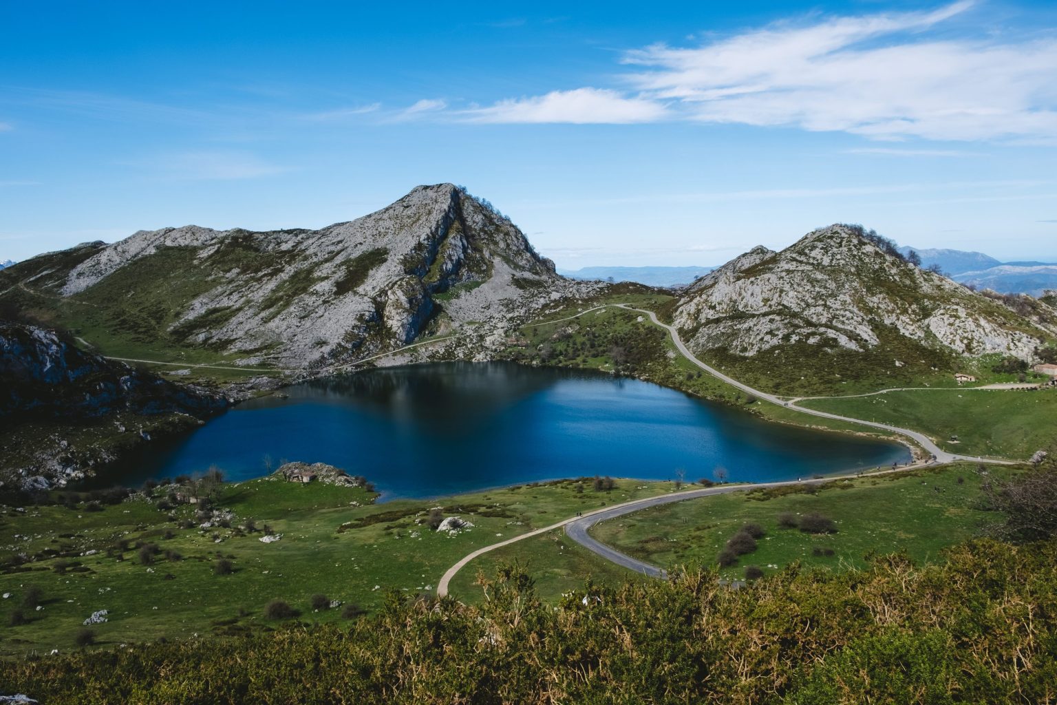 Mountain road beside a lake at Covadonga in the Picos de Europa