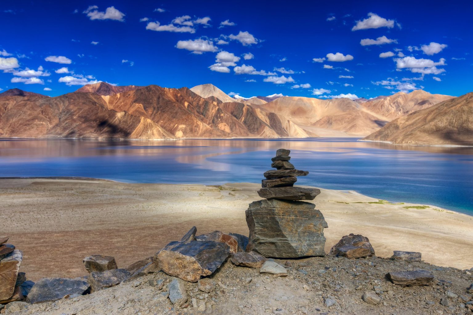 Stone cairn on the shore of Pangong Lake, Ladakh