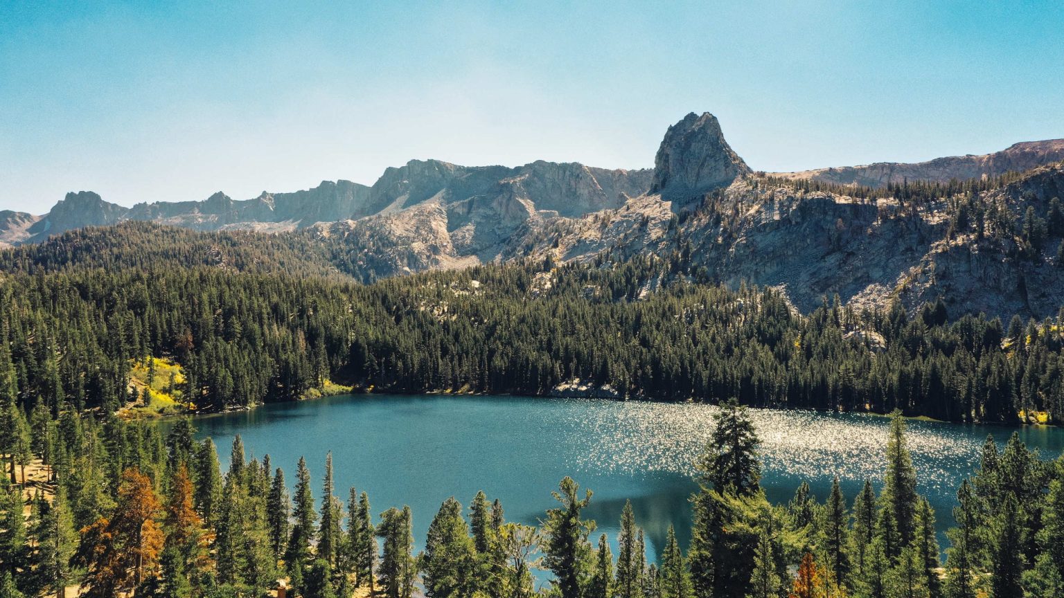 Alpine lake below granite peaks near Mammoth Lakes, California