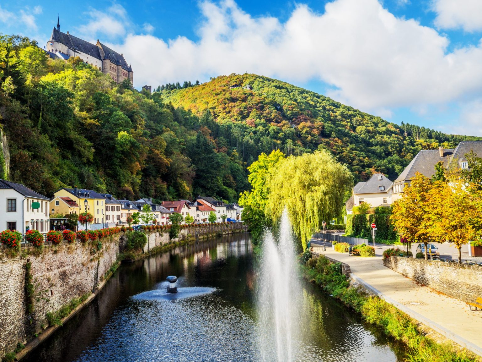 Vianden Castle above a riverside fountain, Luxembourg Ardennes