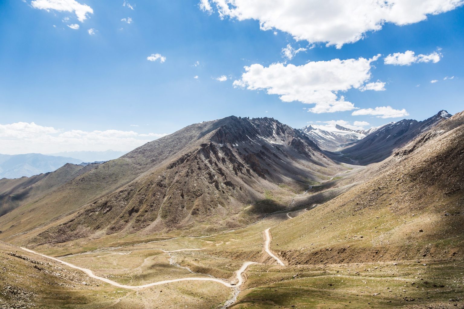 Dirt track through a mountain valley in western Mongolia