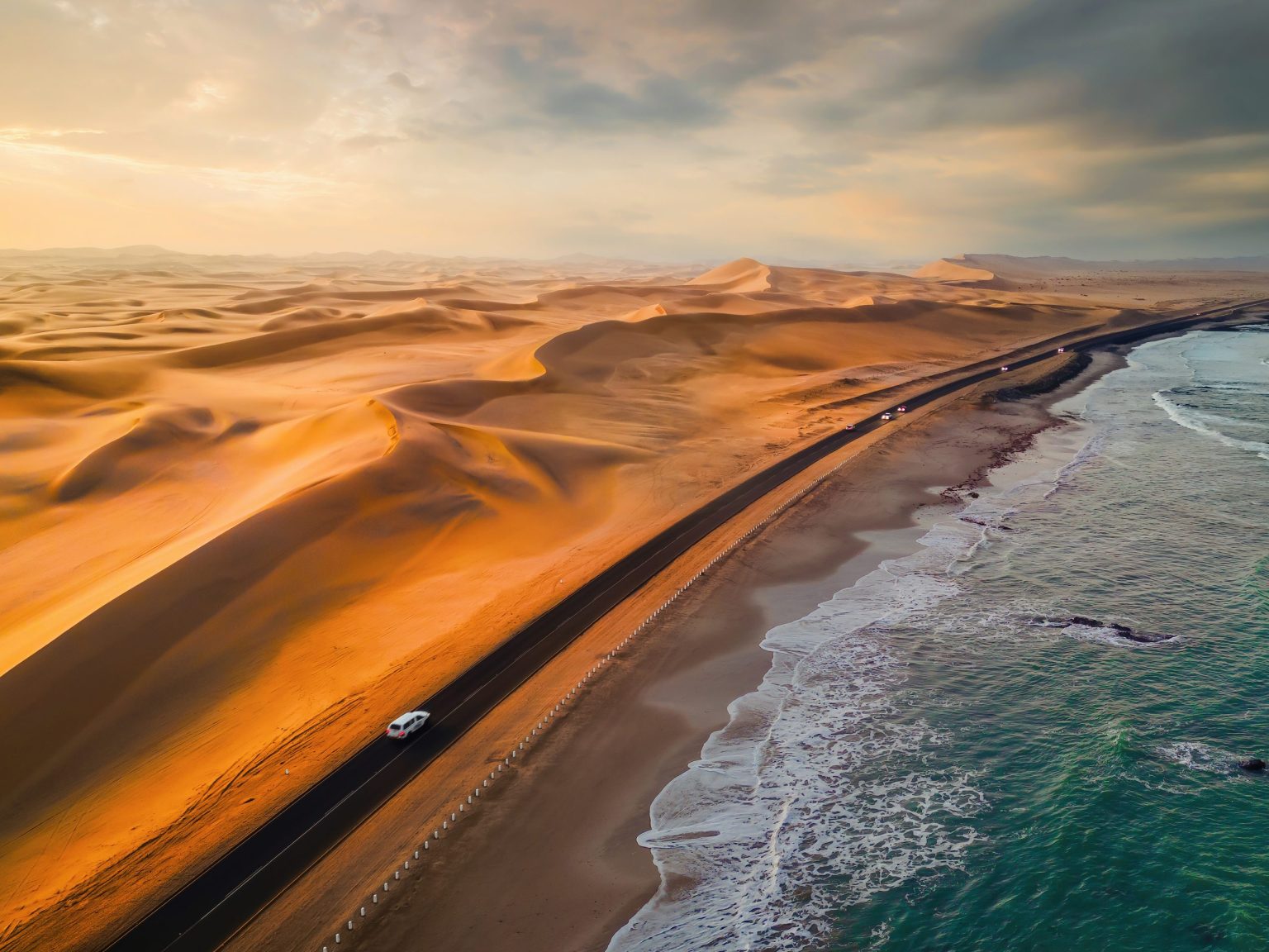 Road between dunes and the Atlantic on the Skeleton Coast, Namibia
