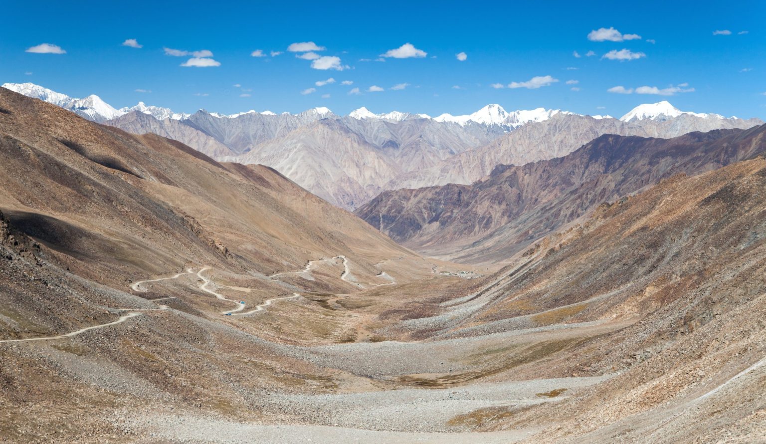 Switchback road climbing a valley in Ladakh