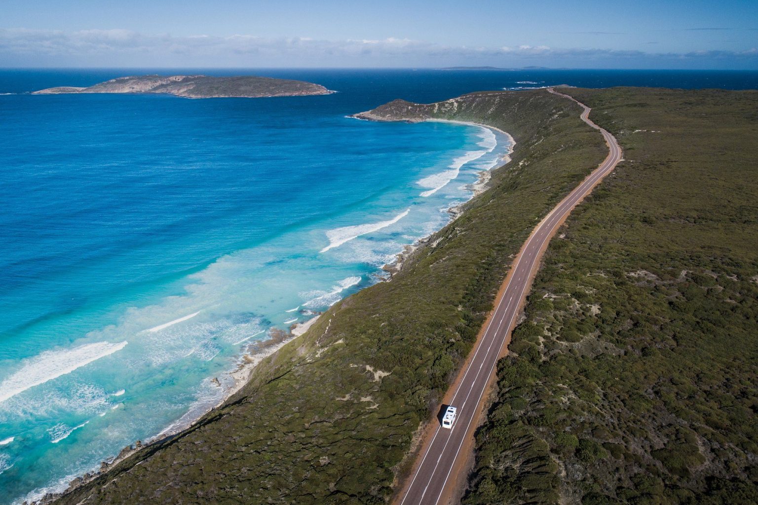 Aerial view of a coastal road beside a turquoise bay, Esperance, Western Australia