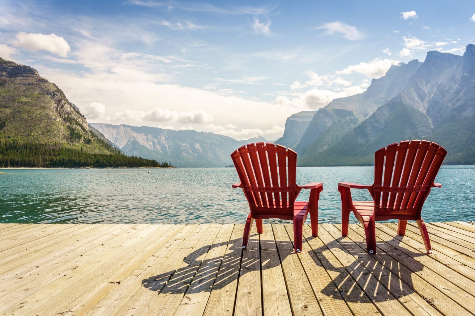 Red Parks Canada chairs overlooking a lake in Banff