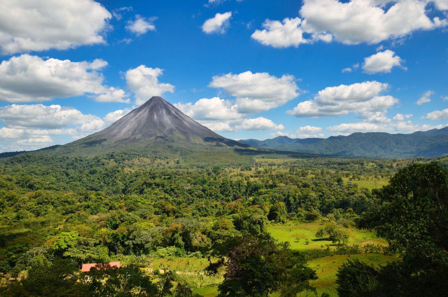 Arenal volcano above the rainforest