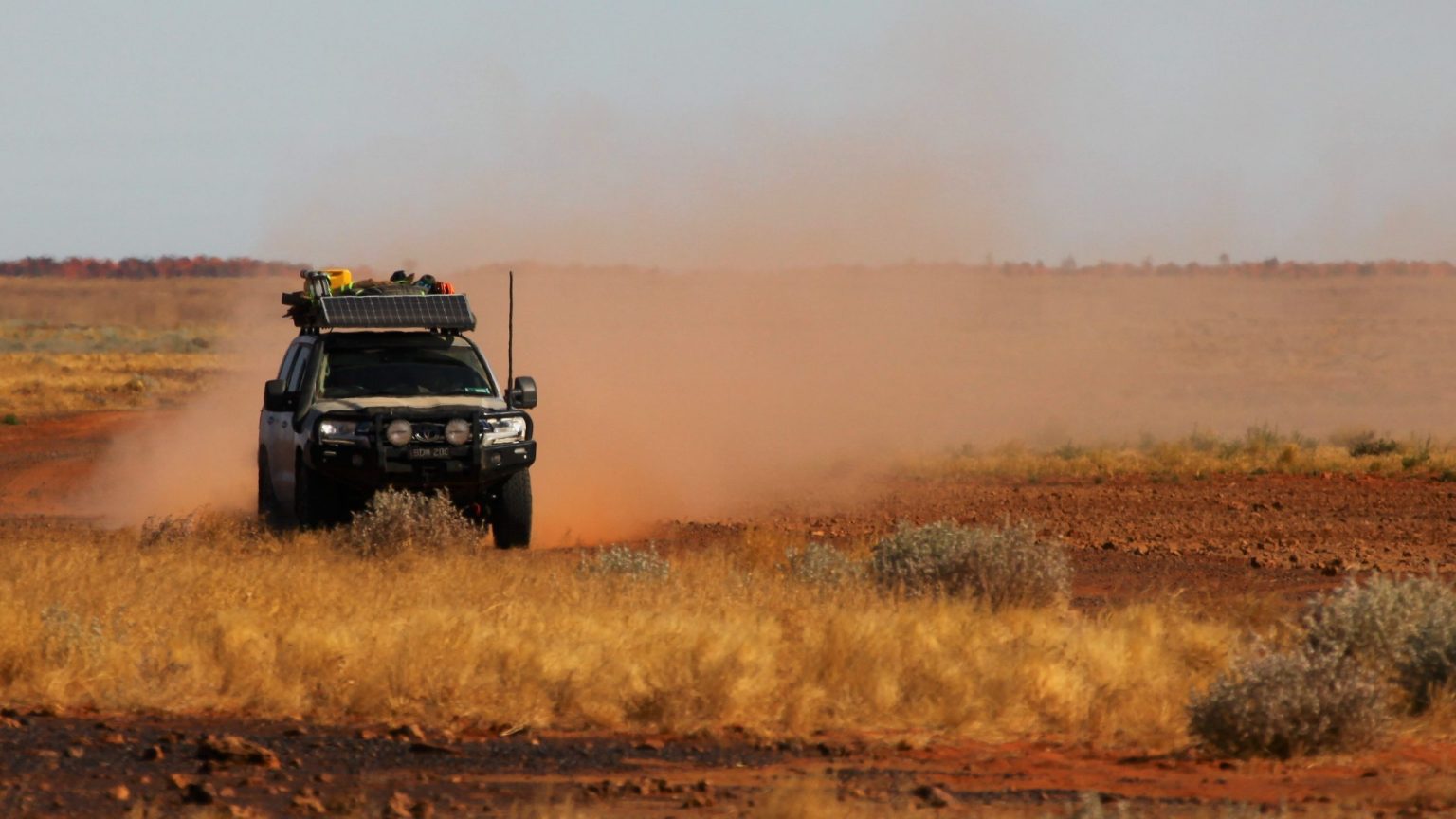4x4 kicking up dust across the Simpson Desert