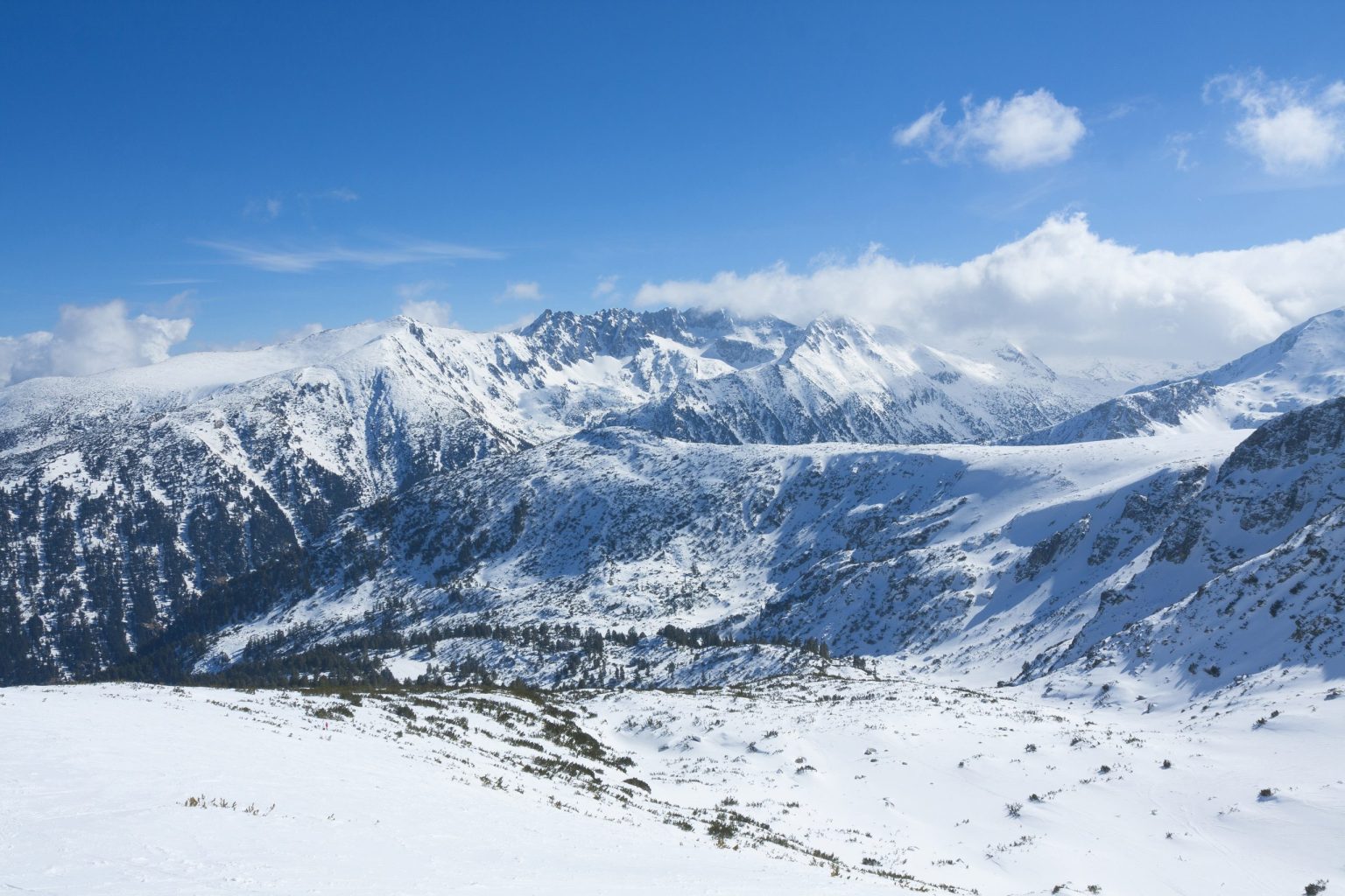 Snowy peaks of the Bulgarian mountains under a blue sky