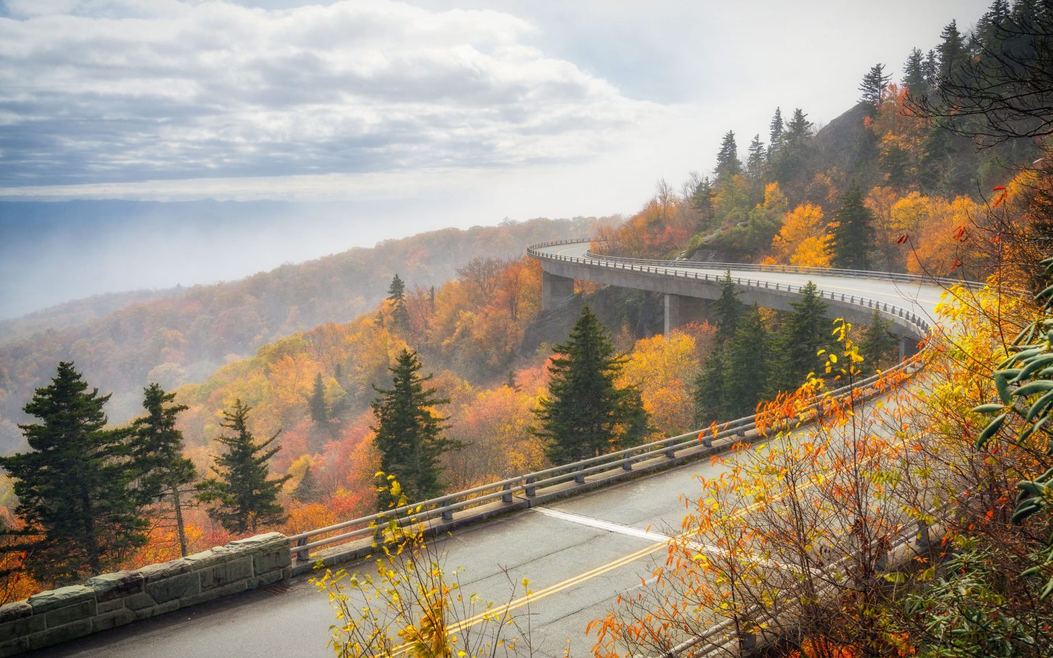 Linn Cove Viaduct curving around Grandfather Mountain on the Blue Ridge Parkway in autumn
