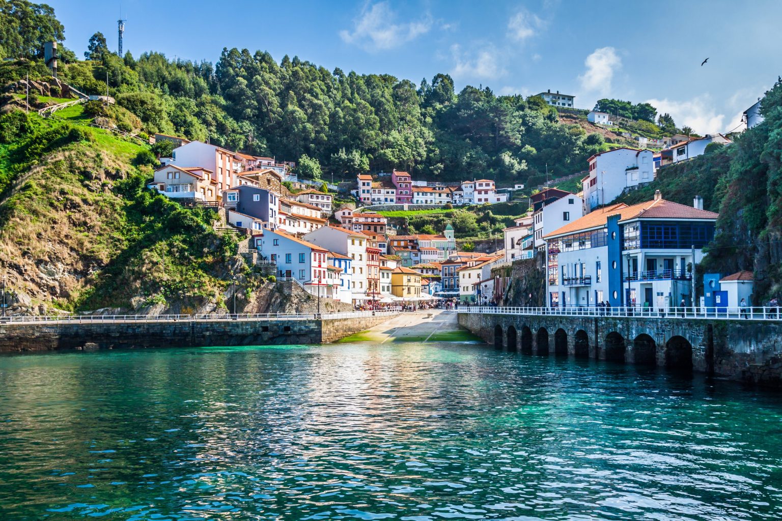 Colourful fishing village around a harbour on the Asturian coast