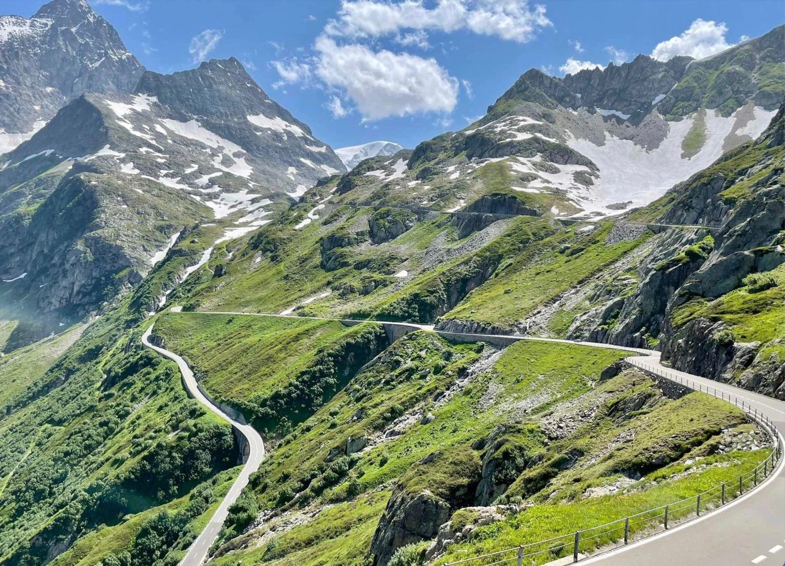 Hairpin road climbing an Alpine pass in Switzerland