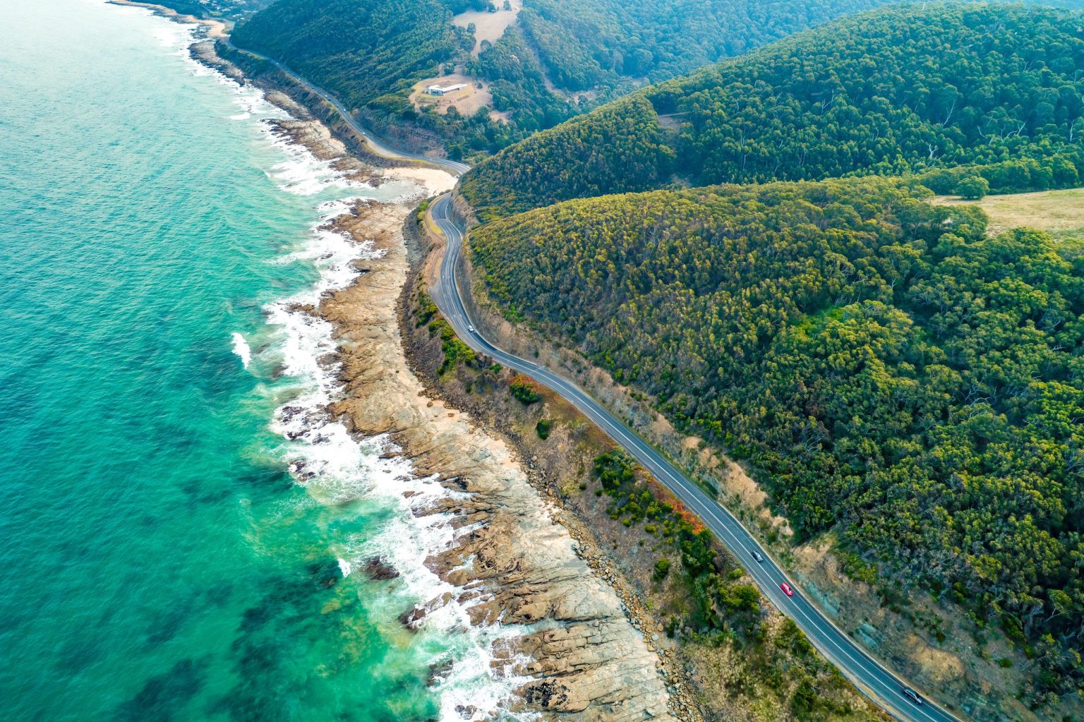 Aerial view of the Great Ocean Road hugging the Victorian coast