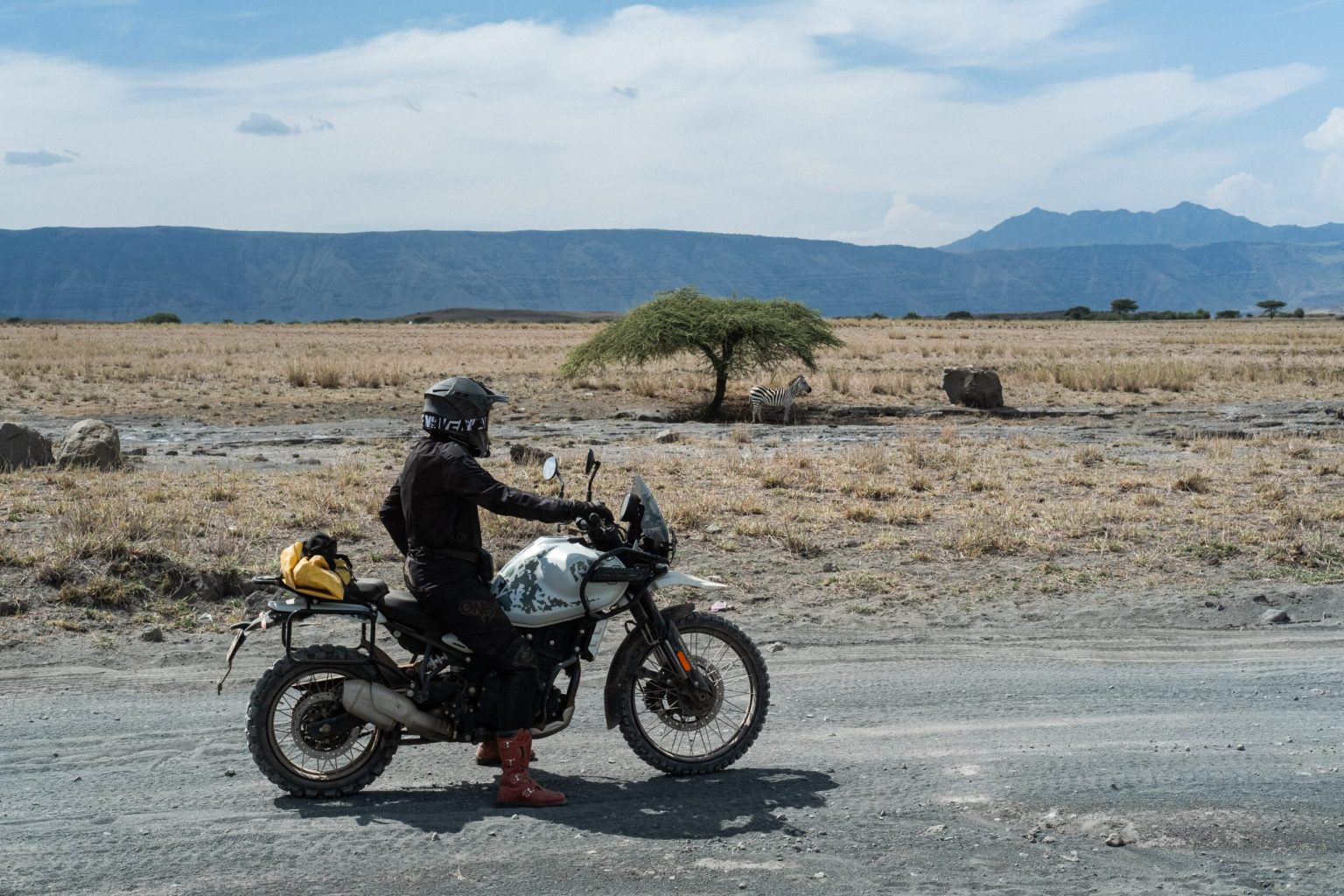 Rider on a dirt track across the plains of northern Tanzania