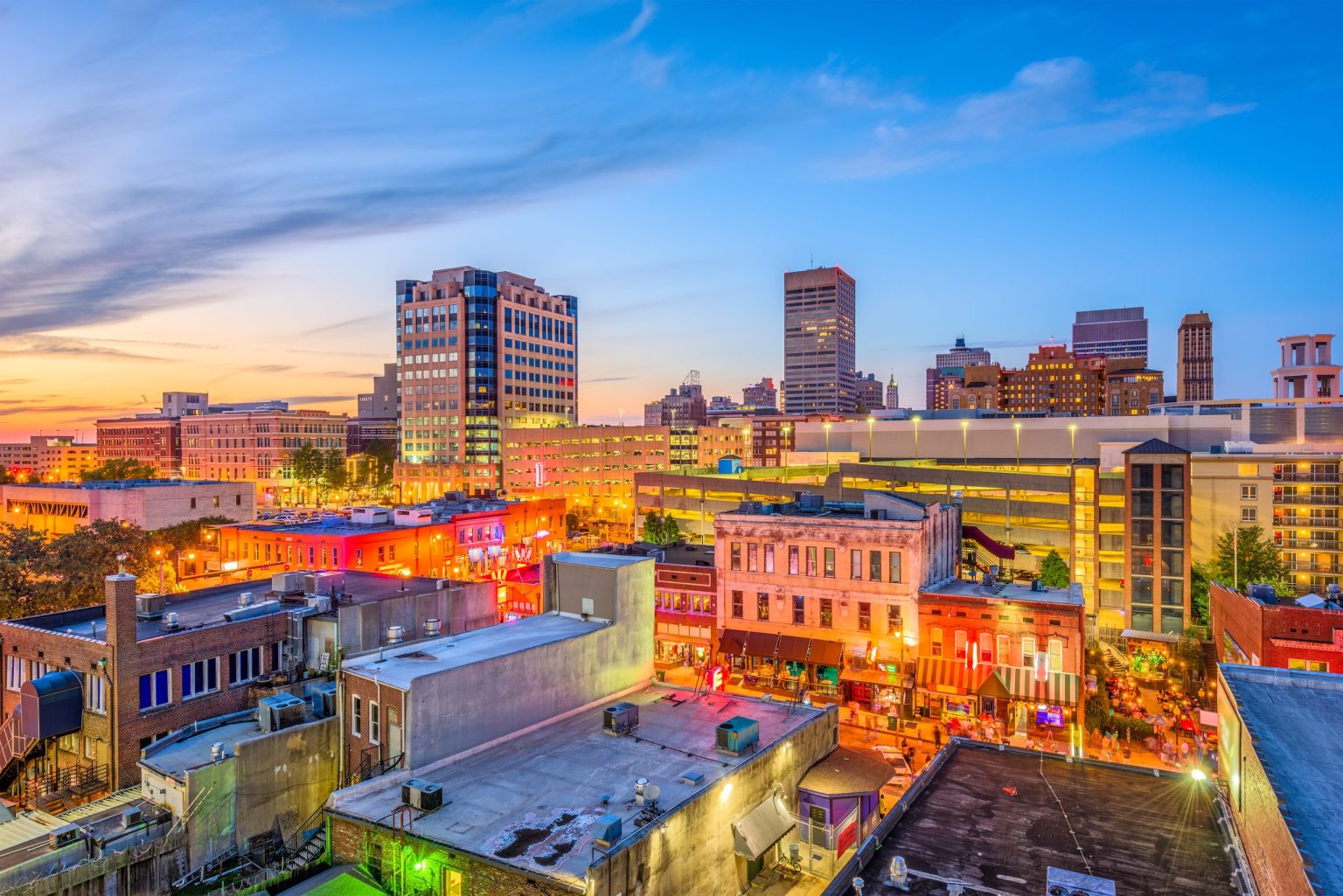 Beale Street and the downtown Memphis skyline at dusk