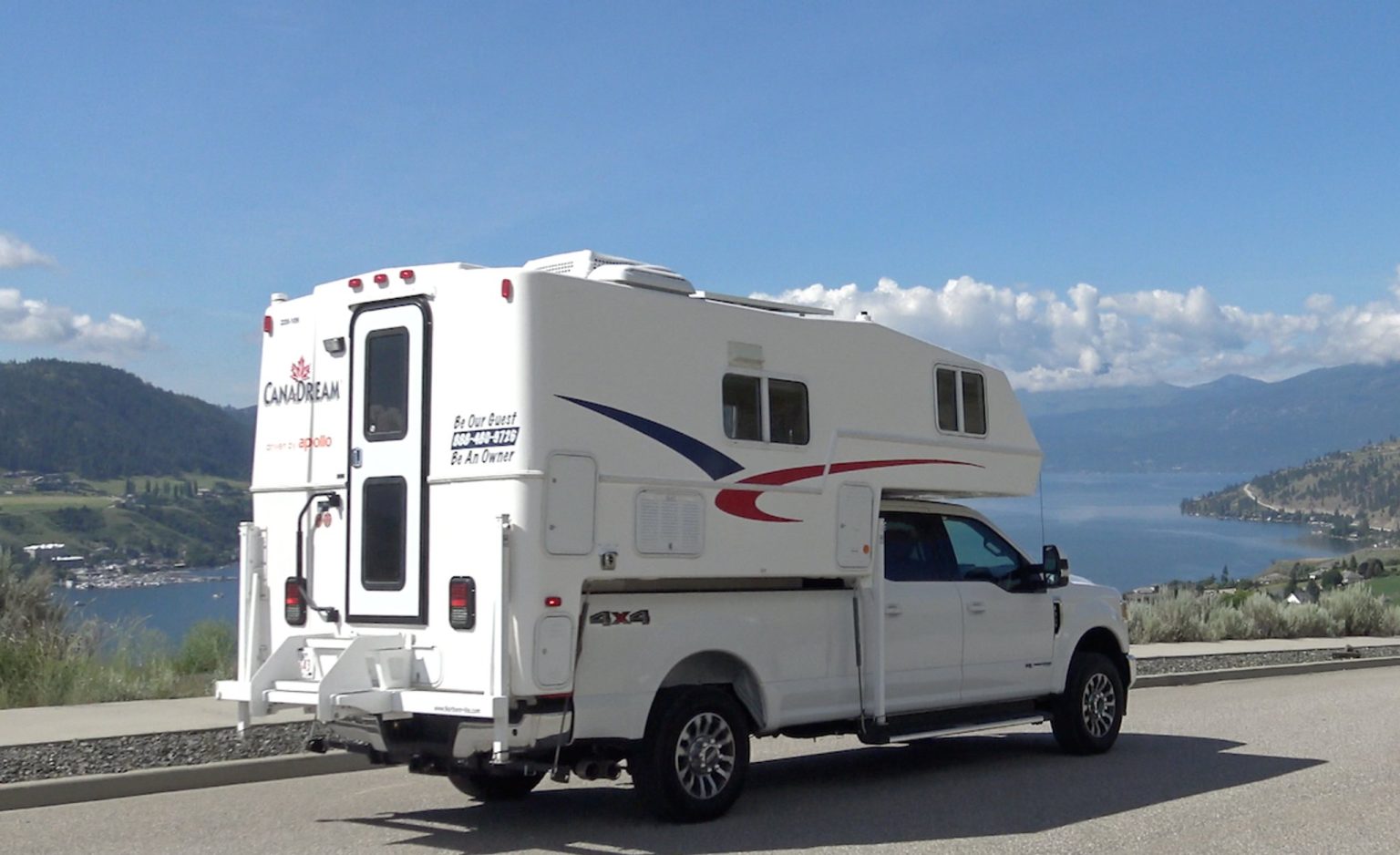 Truck camper parked above a mountain lake, Okanagan, Canada